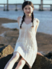 海边度假杏色针织镂空连衣裙女夏季设计感v领吊带沙滩裙背心短裙
