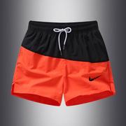 橙色运动短裤男款夏季薄款冰丝速干沙滩裤健身休闲跑步深蹲三分裤
