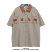 JueAaron日系复古条纹刺绣短袖衬衫男女宽松夏季学院风情侣装衬衣