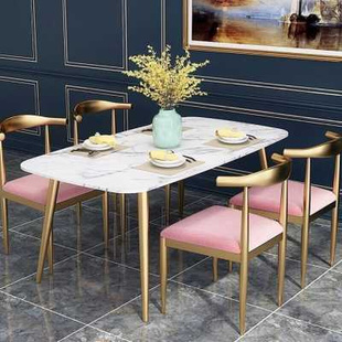 北欧大理石餐桌小户型简约桌子铁艺金色轻奢牛角椅家用长方形饭桌