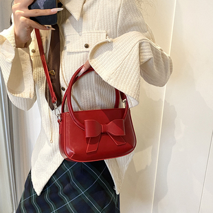新年红色小众蝴蝶结手提包包，女高级质感，百搭ins单肩斜挎水桶包