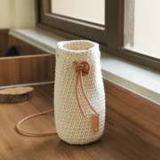 原创纯手工编织棉线保温杯套头，层牛皮绳斜挎水杯，套通用水壶袋