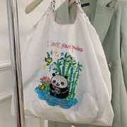 熊猫花花刺绣大容量手提帆布袋环保超市购物袋小众学生通勤包