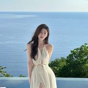泰国三亚旅游拍照沙滩裙海边度假连衣裙纯欲性感镂空白色吊带长裙
