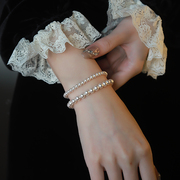 施家金珠珍珠手链女款2024高级感轻奢小众弹力绳珍珠手串叠戴