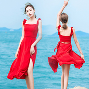 大红色连衣裙女夏2023性感露腰背带开叉木耳边吊带沙滩裙长裙